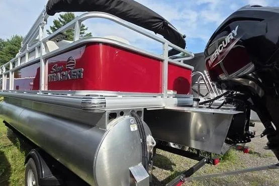 Slide: The Image of 2026 Sun Tracker BB 18 DLX pontoon boat with Mercury outboard motor, red and silver design. - 7