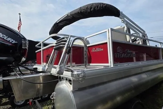 Slide: The Image of 2026 Sun Tracker BB 18 DLX pontoon boat with Mercury engine, red and silver design. - 9
