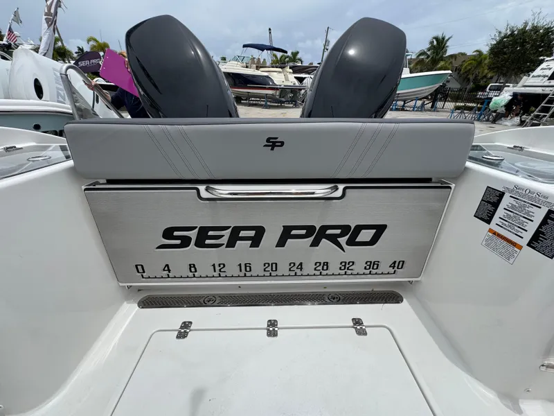 Slide: The Image of 2026 Sea Pro 292 DLX boat interior with branded storage and measurement scale. - 15