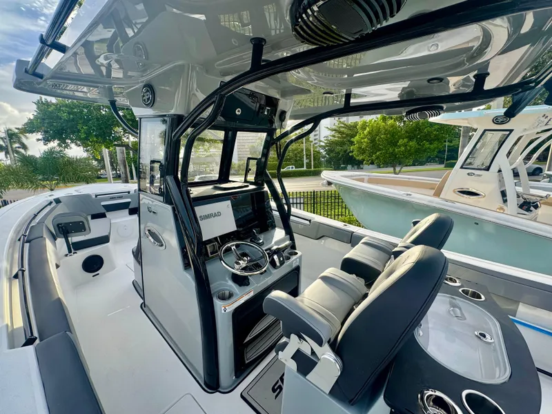 Slide: The Image of 2026 Sea Pro 292 DLX boat interior with modern helm and seating. - 2