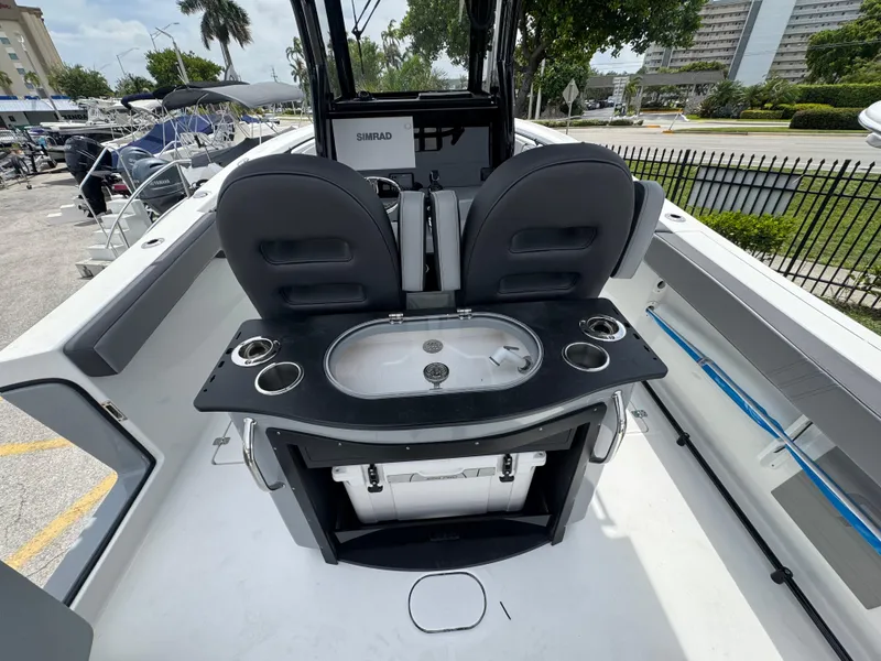 Slide: The Image of 2026 Sea Pro 292 DLX boat interior with seating and fishing station. - 20
