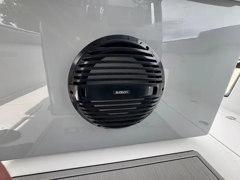 Slide: The Image of Audison speaker on 2026 Sea Pro 292 DLX boat, mounted on sleek white surface. - 31