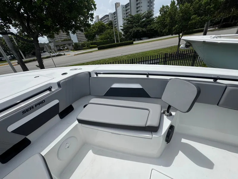 Slide: The Image of 2026 Sea Pro 292 DLX boat interior with seating and modern design. - 39