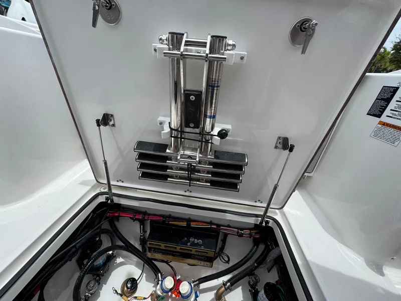 Slide: The Image of 2026 Sea Pro 292 DLX boat compartment with battery and wiring. - 49