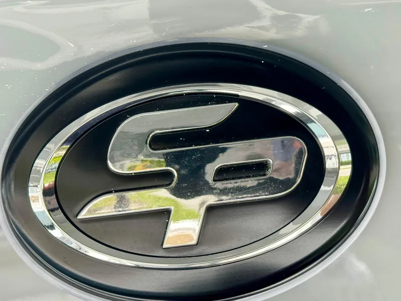 Slide: The Image of Close-up of Sea Pro 292 DLX 2026 logo emblem on a boat. - 52