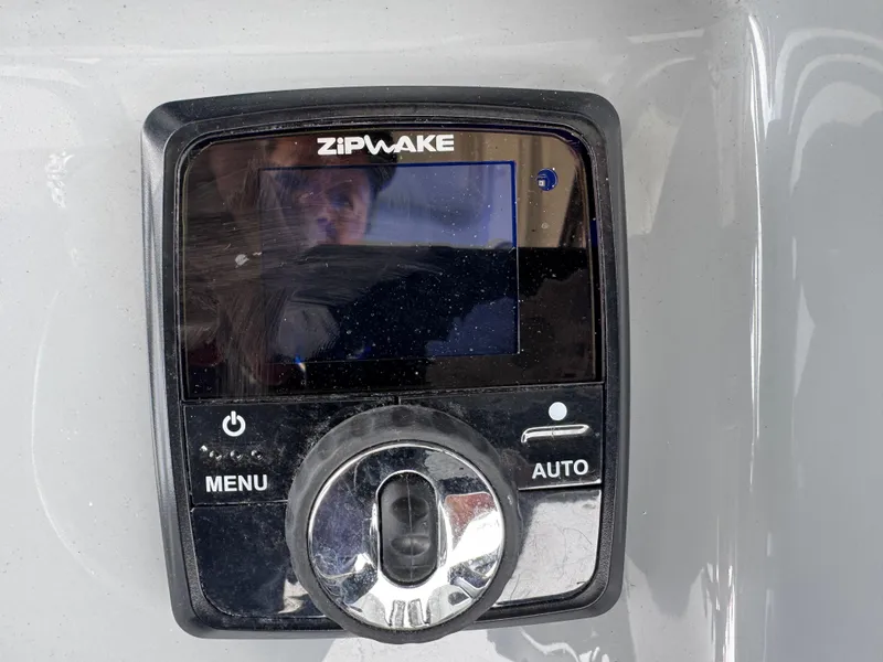 Slide: The Image of Control panel of a 2026 Sea Pro 292 DLX boat with Zipwake system. - 9