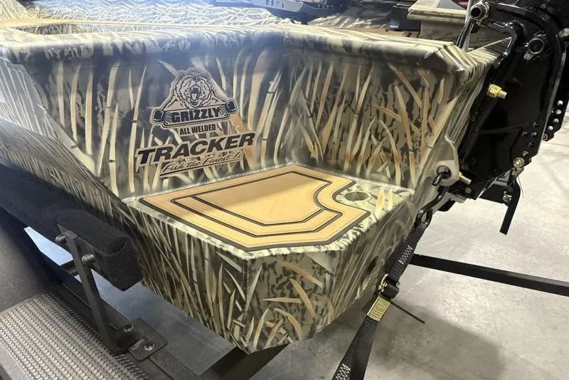 Slide: The Image of 2026 Tracker Grizzly 1650 T Prairie Wings Edition boat with camo design and logo. - 15