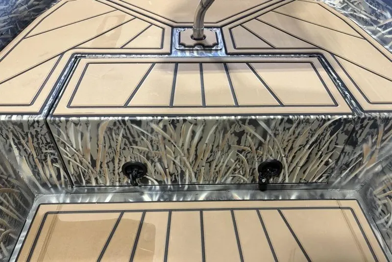 Slide: The Image of 2026 Tracker Grizzly 1650 T Prairie Wings Edition boat interior with camouflage design. - 7