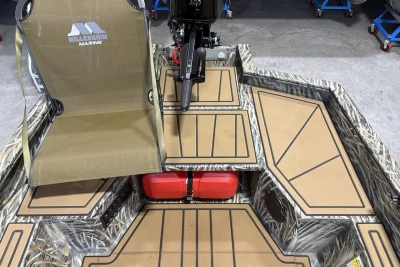 Slide: The Image of 2026 Tracker Grizzly 1650 T Prairie Wings Edition boat interior with camo design and seating. - 8