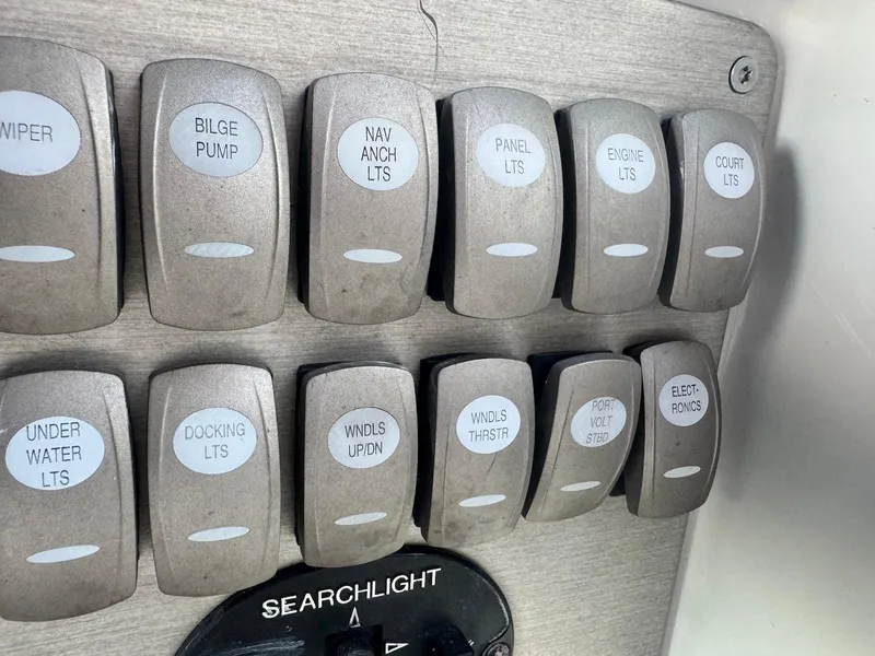 Slide: The Image of Control panel of a 2008 Formula 34 PC boat with labeled switches. - 11