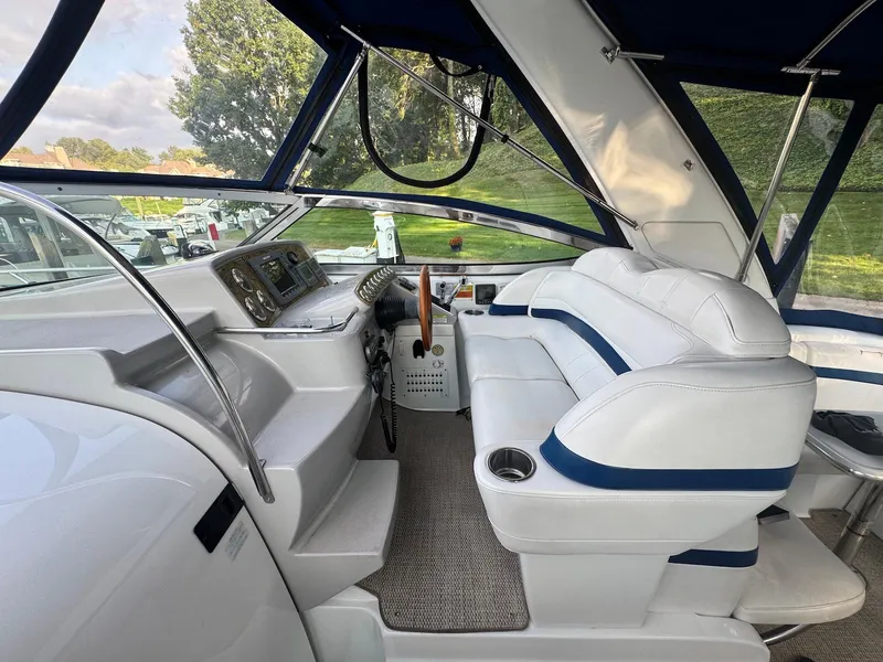 Slide: The Image of 2008 Formula 34 PC boat interior with white seating and control panel. - 13