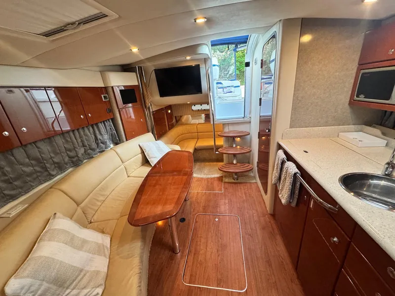 Slide: The Image of Luxurious interior of a 2008 Formula 34 PC yacht with elegant seating and modern amenities. - 19