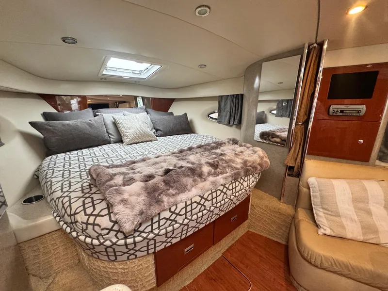 Slide: The Image of Luxurious 2008 Formula 34 PC yacht cabin with cozy bed and modern amenities. - 24
