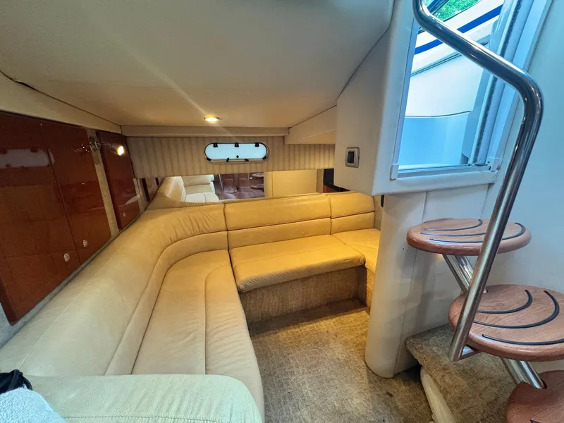 Slide: The Image of Interior of 2008 Formula 34 PC yacht with beige seating and wooden steps. - 25