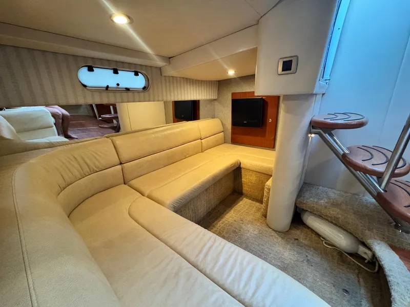 Slide: The Image of Luxurious interior of a 2008 Formula 34 PC yacht with beige seating and wooden accents. - 26