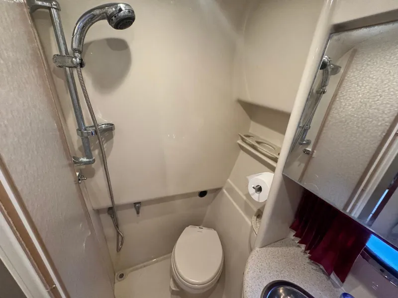 Slide: The Image of 2008 Formula 34 PC bathroom with shower, toilet, and sink. - 27