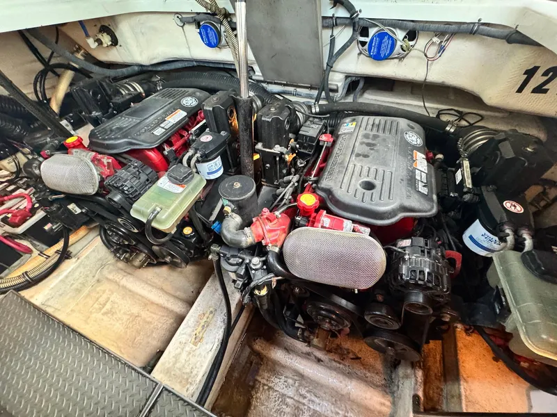 Slide: The Image of Engine compartment of a 2008 Formula 34 PC boat, showcasing dual engines and components. - 31