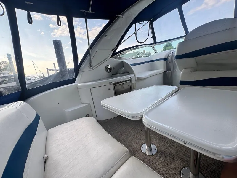 Slide: The Image of Interior of a 2008 Formula 34 PC boat with seating and tables. - 6