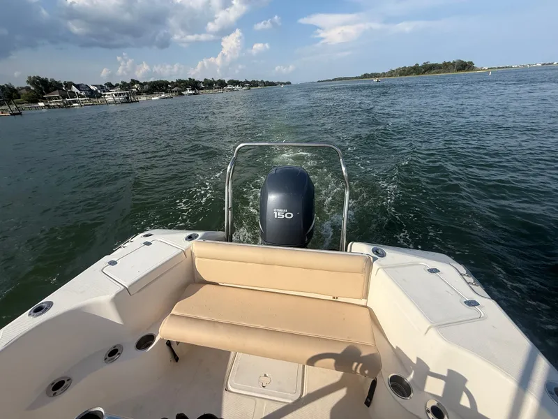 Slide: The Image of 2009 Scout 205 Sportfish boat cruising on a sunny day with Yamaha 150 engine. - 18