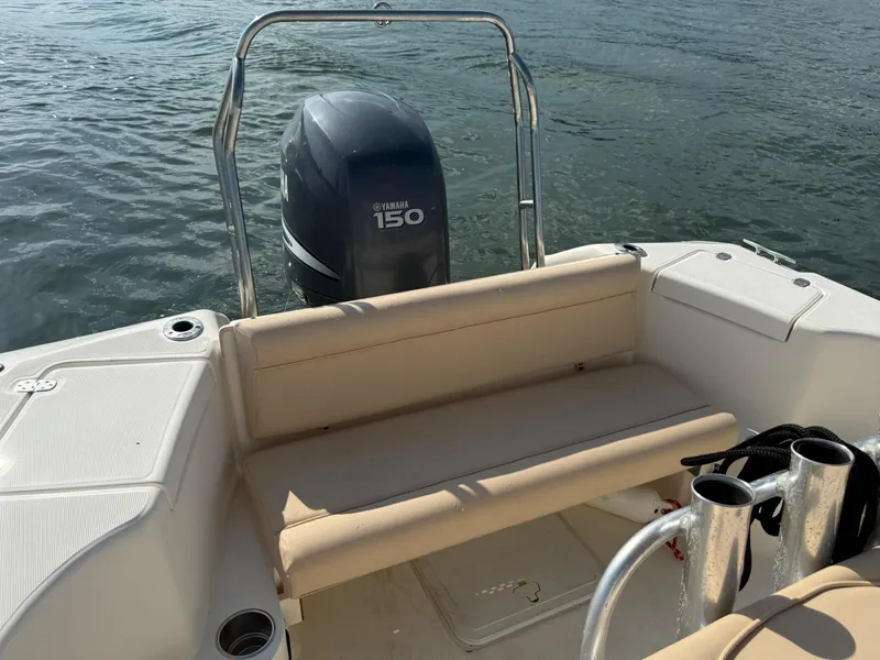 Slide: The Image of 2009 Scout 205 Sportfish boat with Yamaha 150 engine on calm water. - 22