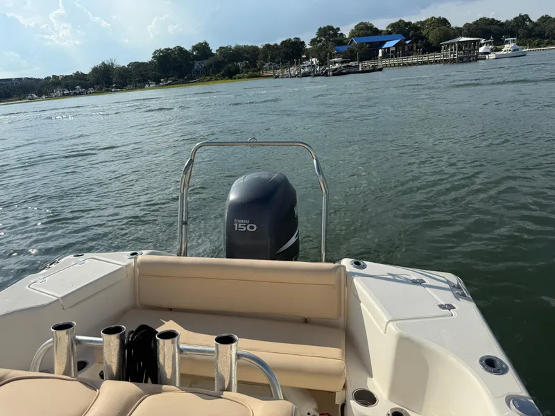 Slide: The Image of 2009 Scout 205 Sportfish boat with Yamaha 150 engine on a calm river. - 29