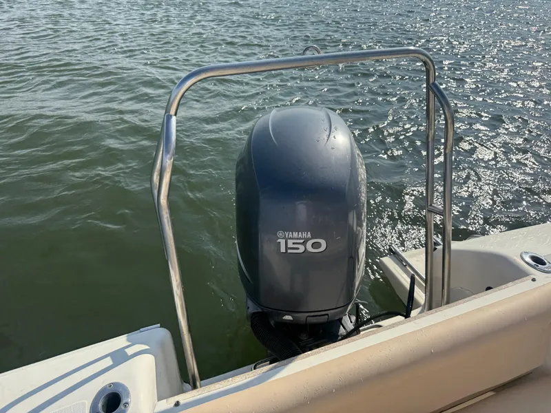 Slide: The Image of 2009 Scout 205 Sportfish with Yamaha 150 engine on water. - 32