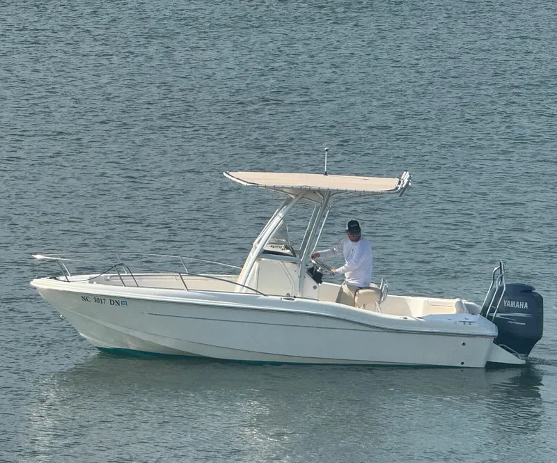 Slide: The Image of 2009 Scout 205 Sportfish boat on water with Yamaha outboard motor. - 4