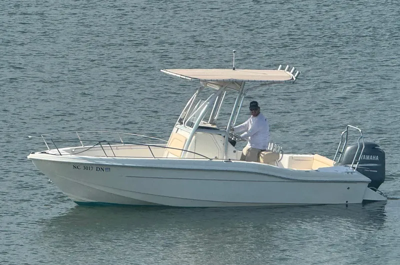 Slide: The Image of 2009 Scout 205 Sportfish boat on water with Yamaha engine. - 6