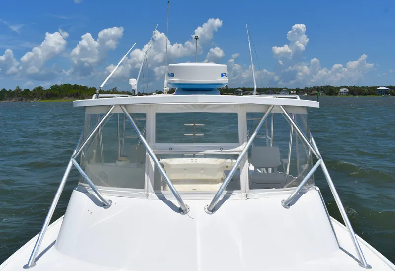 Slide: The Image of 2004 Judge 34 Express boat cruising on a sunny day with clear skies. - 21