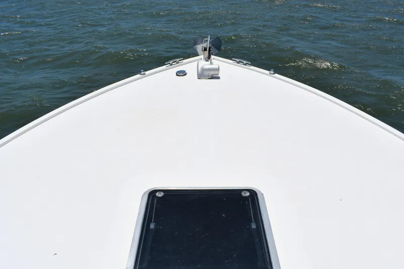 Slide: The Image of Bow of 2004 Judge 34 Express boat on open water. - 24