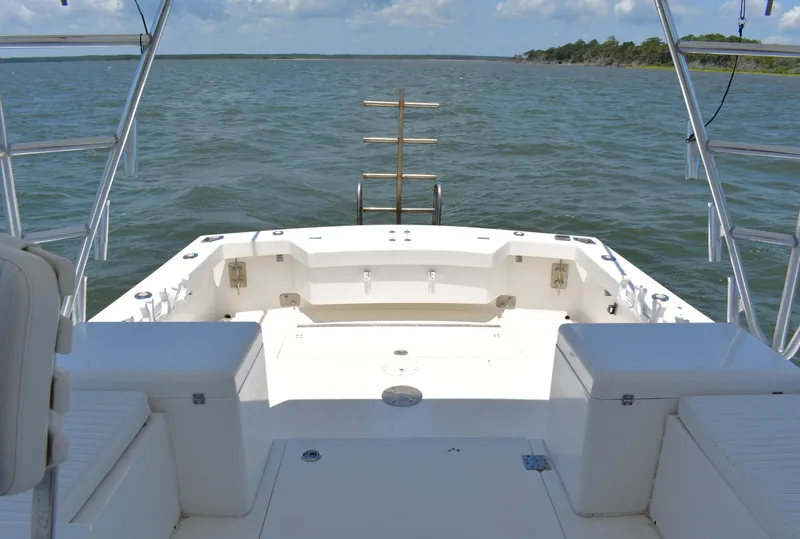 Slide: The Image of 2004 Judge 34 Express boat deck overlooking calm waters and distant shoreline. - 9