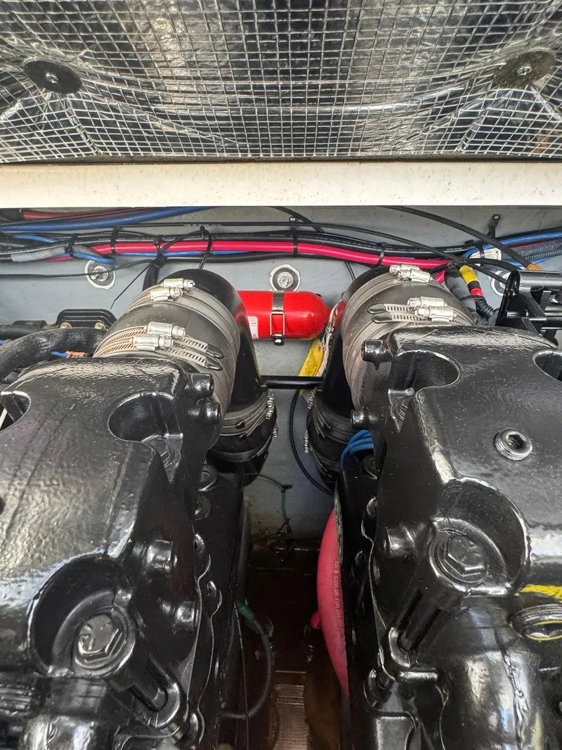 Slide: The Image of Engine compartment of a 2004 Sea Ray 280 Sundancer with visible components and wiring. - 29