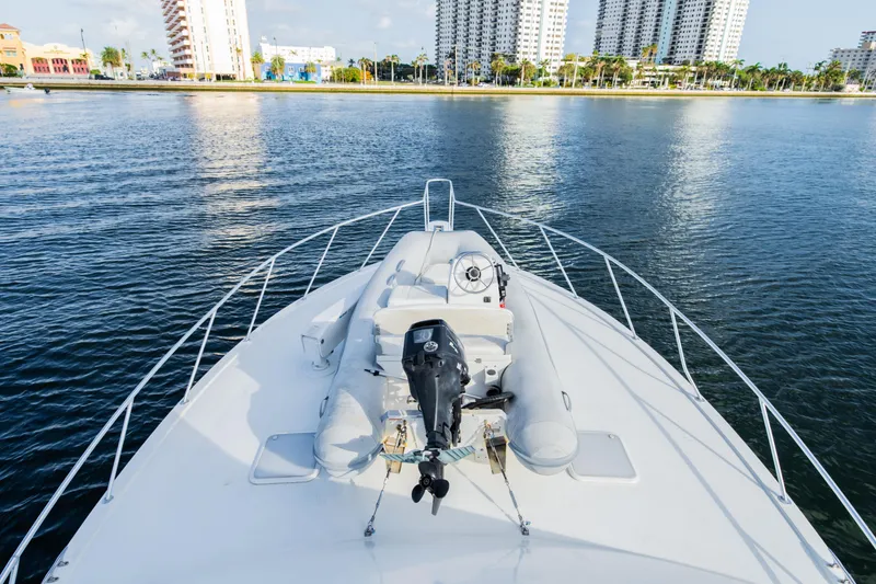Slide: The Image of Bow view of 2008 Post 42 yacht on calm water near city skyline. - 13
