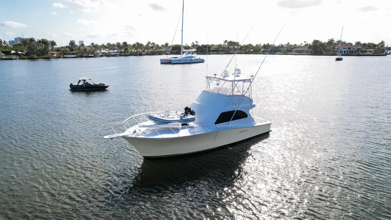Slide: The Image of A 2008 Post 42 yacht on a calm lake with other boats nearby. - 16
