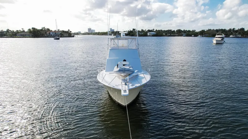 Slide: The Image of Front view of a 2008 Post 42 yacht on calm water under a partly cloudy sky. - 19