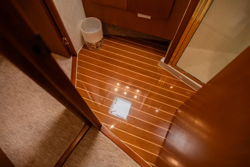 Slide: The Image of Polished wooden floor in a 2008 Post 42 yacht interior. - 42