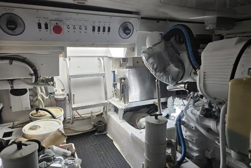 Slide: The Image of Engine room of a 2008 Post 42 boat, featuring machinery and control panels. - 52