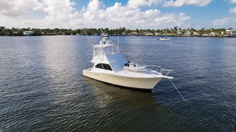Slide: The Image of A 2008 Post 42 yacht on calm waters under a partly cloudy sky. - 9