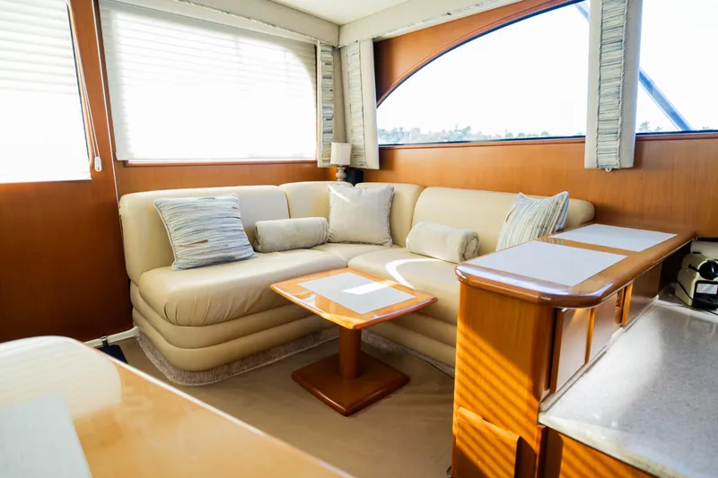Slide: The Image of Luxurious yacht interior with beige seating, wooden accents, and natural light. Post 42, 2008 model. - 36