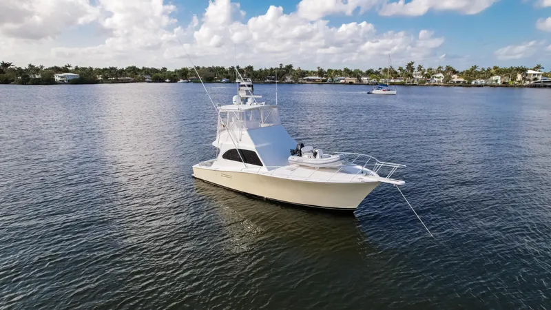 Slide: The Image of A 2008 Post 42 yacht on calm waters under a partly cloudy sky. - 8