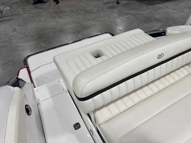 Slide: The Image of 2012 Cobalt A-25 boat with white leather seating and sleek design. - 10