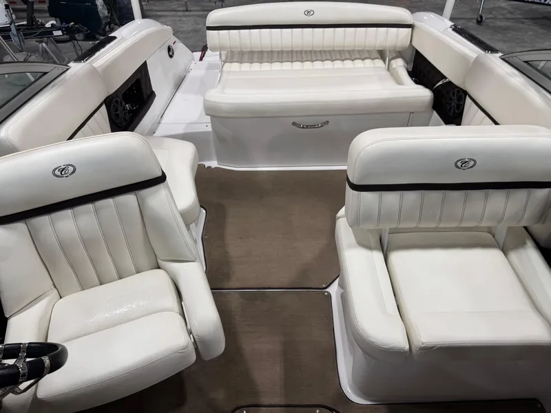Slide: The Image of Interior of a 2012 Cobalt A-25 boat with white leather seating. - 13