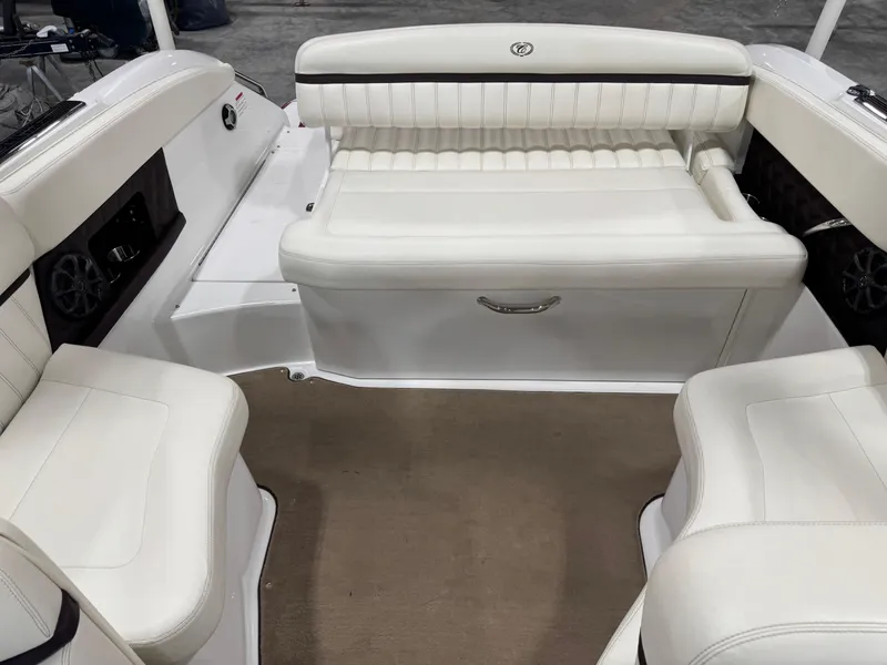 Slide: The Image of Interior of a 2012 Cobalt A-25 boat with white leather seating. - 14