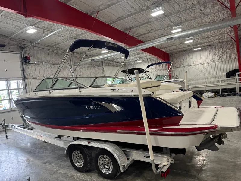 Slide: The Image of 2012 Cobalt A-25 boat on trailer in indoor storage facility. - 3