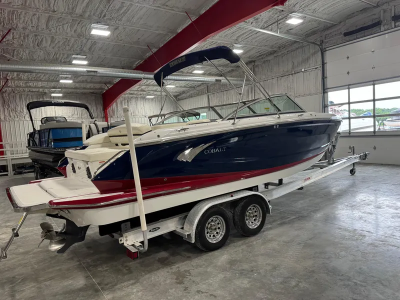 Slide: The Image of 2012 Cobalt A-25 boat on trailer in indoor storage facility. - 4