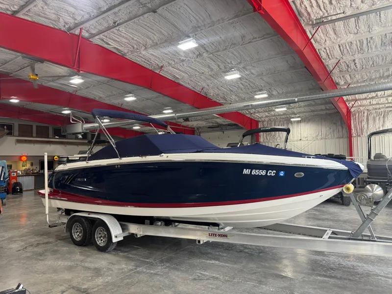 Slide: The Image of 2012 Cobalt A-25 boat on trailer in indoor storage facility. - 6