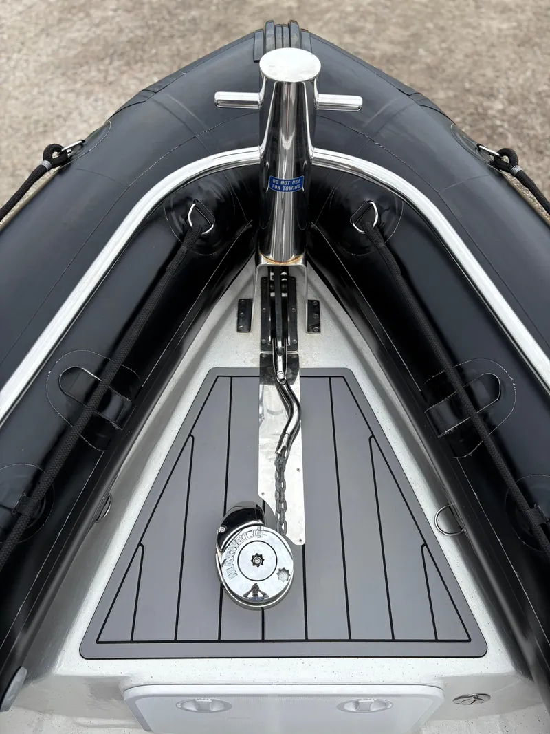 Slide: The Image of Bow of 2020 Protector 310 Targa boat with anchor chain and deck details. - 11