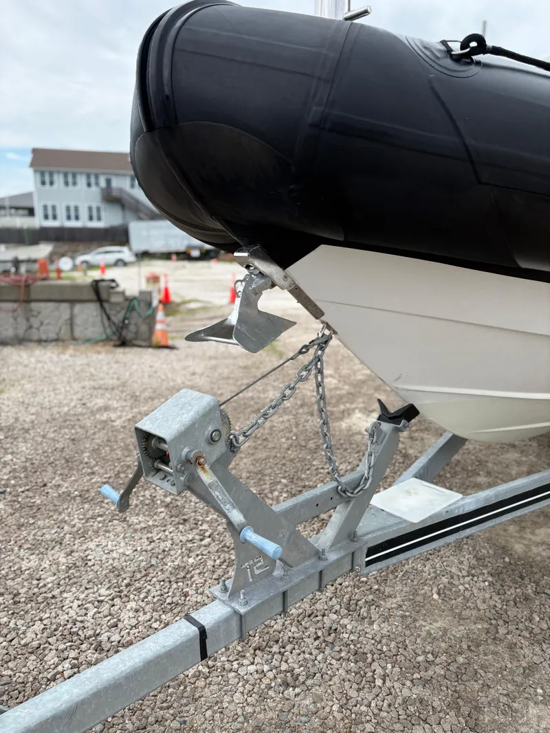 Slide: The Image of 2020 Protector 310 Targa boat on trailer, close-up of bow and anchor. - 15