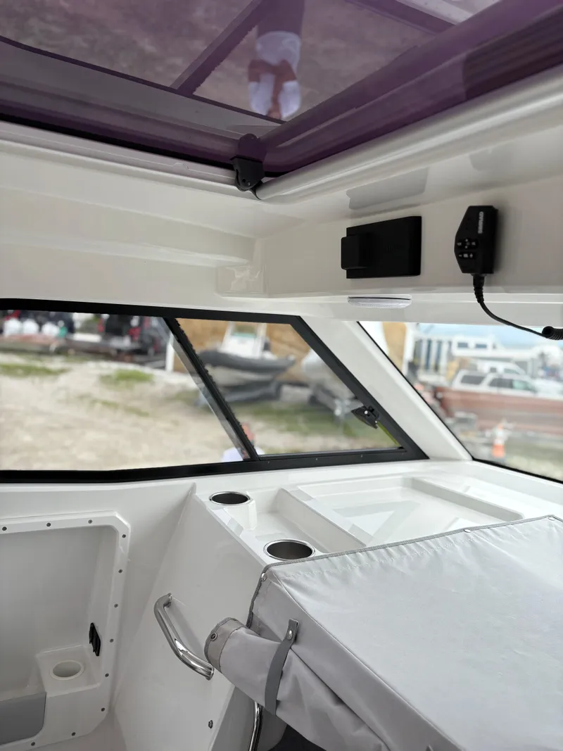 Slide: The Image of Interior view of a 2020 Protector 310 Targa boat, featuring modern design elements. - 24