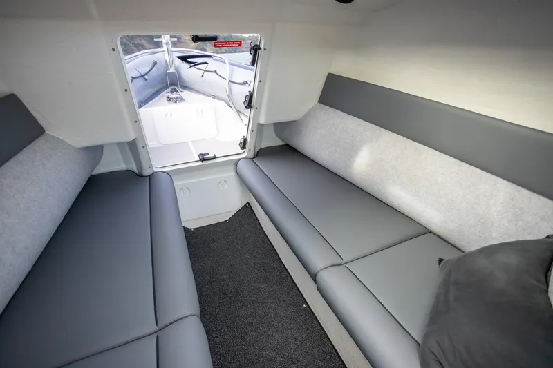 Slide: The Image of Interior cabin of 2020 Protector 310 Targa boat with gray seating. - 27